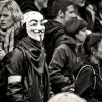 Protestors affiliated with "Anonymous" group. Photo: wiki commons.