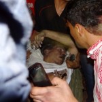 A man, believed to be Ambassdor Stevens, being carried by civilians in Libya. Photo: AFP/Getty.