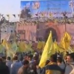 Fatah supporters wave flags at the 48th anniversary celebration. Photo: Screenshot.
