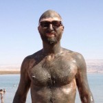 Jonathan Ames, creator of the HBO television series "Bored to Death," takes a mud bath at the Dead Sea in Israel. Photo: Courtesy Jonathan Ames.