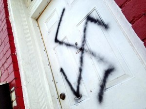 A door spray-painted with a swastika. Illustrative photo: Twitter.