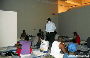 Muslim refugees find shelter and a hot meal at a soup kitchen in Milan. Photo: Chabad.org.