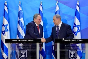 Israeli Prime Minister Benjamin Netanyahu (right) meets with Greek Foreign Minister Nikos Kotzias in Jerusalem on Monday. Photo: Israeli Prime Minister's Office.