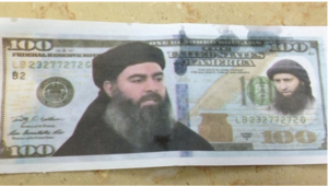 A printout of a $100 bill featuring the portraits of ISIS leader Abu Bakr al-Baghdadi and Al-Nusra Front leader Mohammed al-Julani. Photo: Screenshot