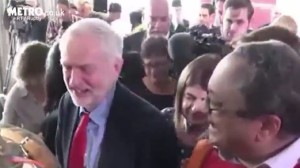 Labour head Jeremy Corbyn (L) and Momentum activist Marc Wadsworth (R) seen sharing a laugh following a conference announcing the results of the party's antisemitism probe. Photo: Video Screenshot.
