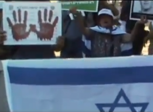 protesters Israelis protest the Cabinet's decision to free 104 prisoners, with "blood on their hands." Photo: Tazpit News Agency, Screenshot.