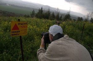 The author, photographing a minefield in the Israeli Golan Heights. Photo: Andy Alpern The author, photographing a minefield in the Israeli Golan Heights. Photo: Andy Alpern