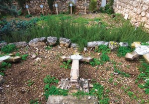 Damage to cruciform tombstones at the Beit Jamal monastery in Israel. Photo: Latin Patriarchate of Jerusalem. 