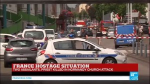 Police cars surrounded the scene of Tuesday's attack in Normandy where ISIS terrorists took hostages and killed a priest. Photo: Twitter,