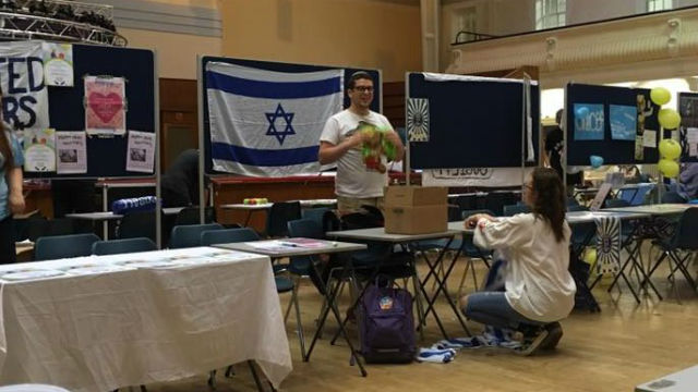 Binyomin Gilbert, at Israel stand at Israel stand at Goldsmiths, University of London. Photo: Facebook.